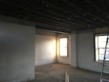 Before: The second level before the curved wall and bedrooms were installed.  Photo 5 of 14 in Before & After: A Melbourne Pub Is Recast as a Funky Home