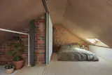 A skylight in the mezzanine creates an airy sleeping area.