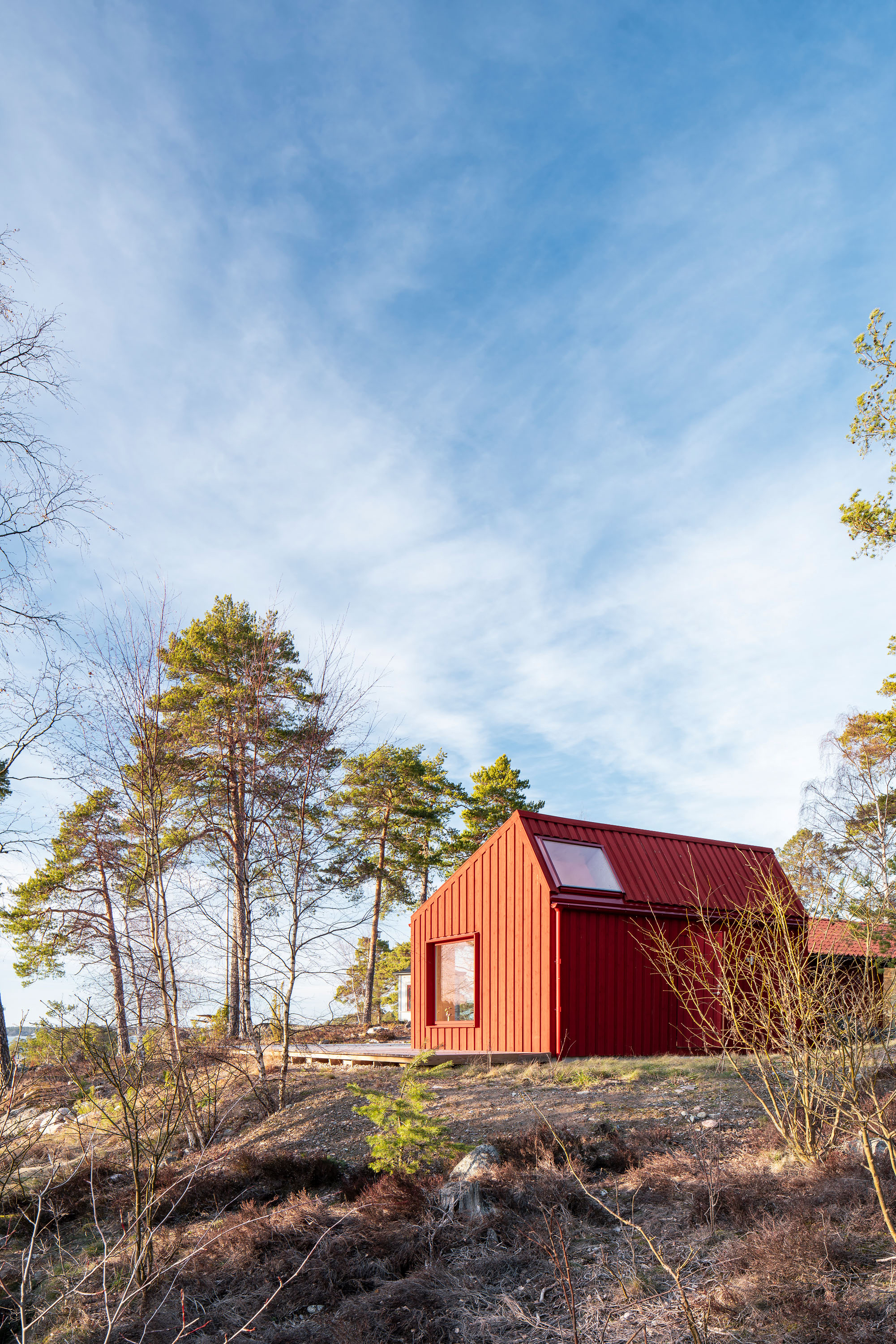 A Tiny Cabin in Rural Sweden Pops With Red Pinewood - Dwell
