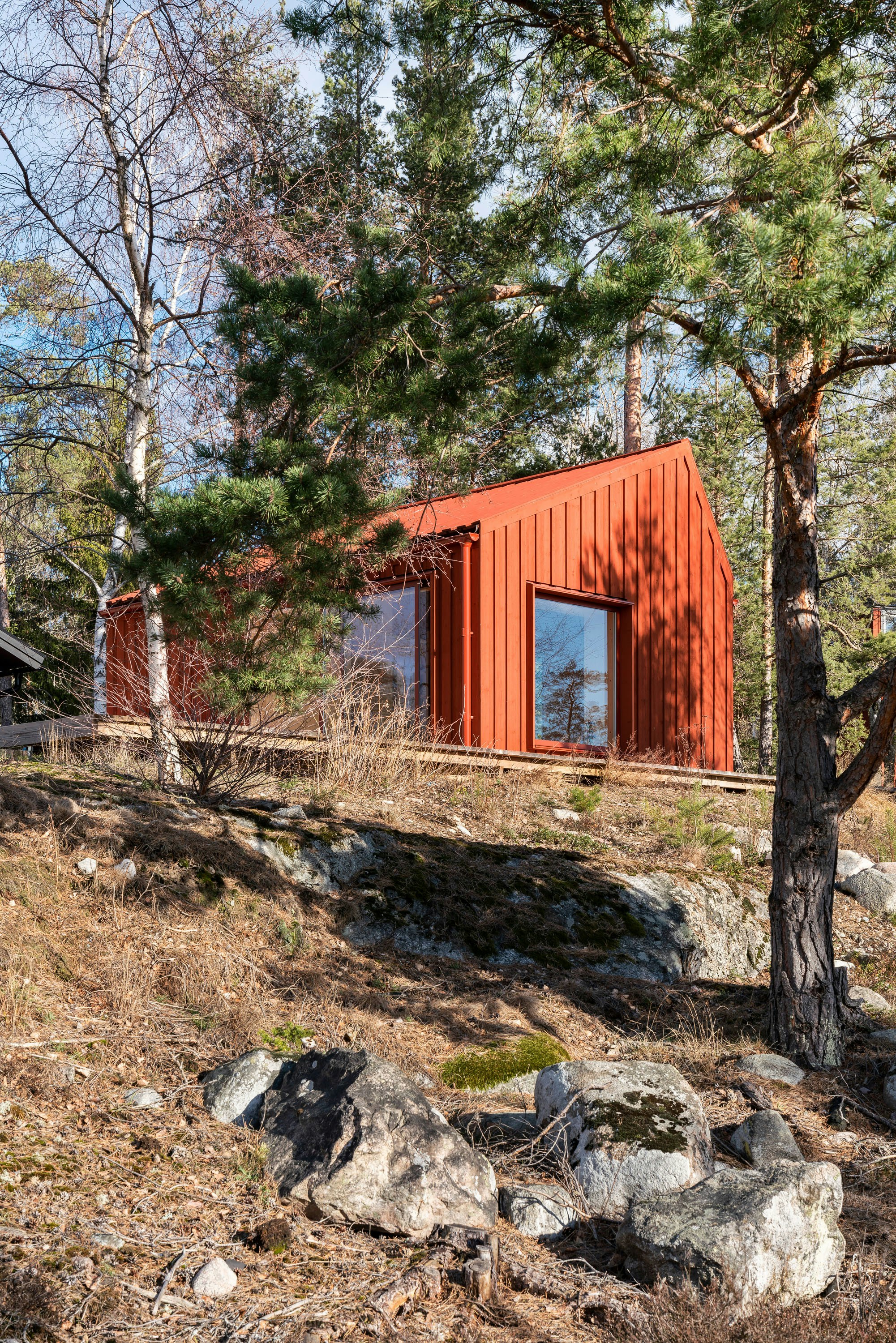 Nordic Blue Front Door on a Rustic Red House