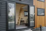 Stevens offset the vinyl with cedar siding on the front facade.