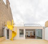 This Rooftop Apartment With a Bright Yellow Staircase Is Sunshine in a Bottle