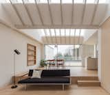 Skylights punctuate the ceiling, flooding the dining and living areas with natural light.