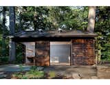 GreenSpur and McAllister Architects imagined a cabin sided with Cor-Ten steel, glass, and shou sugi ban–treated cedar for a wooded property outside of Washington, DC.