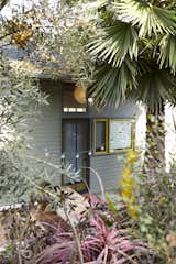 Architects Bo Sundius and Hisako Ichiki built a backyard cottage on their Los Angeles property for Sundius’s aging parents. The duo selected a pale shade of green for the lap wood siding so the home would blend into its lush landscape shrouded by trees and plantings.&nbsp;
