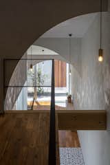 The home's numerous arches lend poetry, geometry, and a dynamic quality to the home as their soft curves frame various perspectives and provide a feeling of airiness.