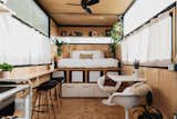 At 23 years old, self-taught designer Mariah Hoffman set out to craft her own 156-square-foot sanctuary.&nbsp;The interior of her tiny home features an open floor plan and an exposed, black-steel structural frame that informs the material palette for the furnishings.&nbsp;She clad the walls with light-toned birch paneling that contrasts with the structural frame, adding warmth and texture.