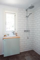 Norske Mikrohus offers customizable baths, letting customers choose flooring and wall finishes.