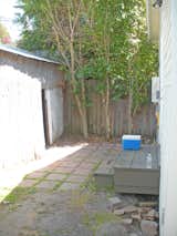 Before: The cottage’s original, uninspired backyard area gave the owners an opportunity to extend the small living space.