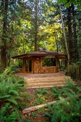 The hexagonal backyard studio that Marlin and Ryan Hanson, of Hanson Land &amp; Sea, designed and built in British Columbia, Canada, is clad with western red cedar shakes and a metal roof.