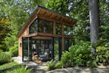 Exterior, Shed Building Type, Shed RoofLine, Glass Siding Material, Metal Roof Material, and Wood Siding Material  Agnieszka Jakubowicz’s Saves from Bookshelves Conceal Hidden Rooms in This Secret-Filled Backyard Studio