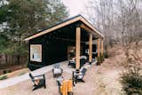 The Lily Pad is a 280-square-foot black-painted shipping container home located near Hocking Hills State Park in Ohio.