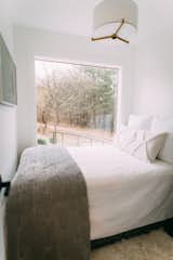 "The large window in the bedroom lets you feel like you're sleeping outside," Dianna says. "We added a motorized shade for privacy is needed."