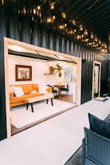 When the roll-up garage-style door is open, the living room links to the porch, creating an indoor/outdoor living experience.