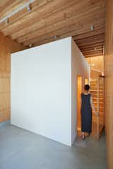 Sasaki designed a white-painted box-like insert just beyond the office. The volume holds two bathrooms and a utility room.