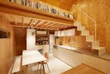 Sasaki placed an open-plan kitchen, dining area, and living space on the second level; a flexible loft space is situated above the kitchen.