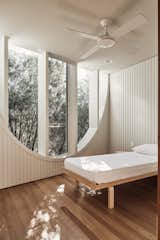 The windows in the bedrooms frame treetops, allowing for privacy.