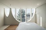 The arched windows provide a treehouse-like experience for some of the bedrooms.