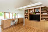 The second level showcases built-in cabinetry and an office area crafted from cedar.