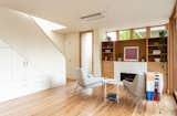 The open-plan living area features rift-cut white oak flooring.