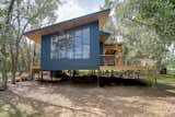 Exterior, Wood, Metal, Treehouse, and Shed The Sapling is clad with board-and-batten and features a gazebo with a hexagonal opening on the rear deck.  Exterior Metal Shed Treehouse Photos from Book a Stay in This Whimsical Trio of Tiny Tree Houses