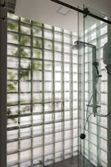 A glass-block shower in the master supplies the feeling of being outdoors.