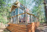 A sleeping loft in this Durham, North Carolina, tiny home provides the feeling of a tree house.