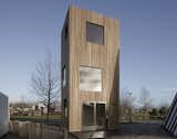 Ana Rocha Architecture designed this tall and narrow micro home for small and slender lots in cities in the Netherlands. The exterior is clad in Ayous wood.