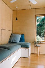Wattle Bank shipping container tiny home built-in sofa with storage