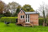 A tiny home in England, built by a 17-year-old for $8,000, is wrapped in reclaimed wood.