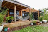 Exterior, Tiny Home Building Type, Wood Siding Material, and Flat RoofLine Shaye’s tiny home is clad with metal and wood and features a living wall on the interior.  Photo 11 of 12 in 12 Inspiring Tiny Homes That Were Entirely DIY’ed