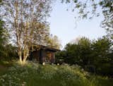 With its emphasis on the outdoors, the petite shelter in Normandy offers room to roam.
