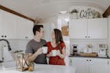 The Binkerds sip coffee in the sun-filled kitchen of their tiny home on wheels.