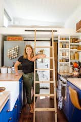 Sophia Jungbauer stands in the kitchen of the 324-square-foot home she built with her husband, Henry, in Duluth, Minnesota.