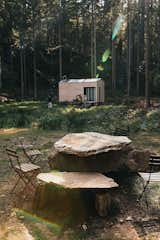 "The tiny home is parked in a forest, where there's an old stone quarry," Anna says. "The land belongs to our friend Andy, who suggested we build outdoor tables with some of the boulders."