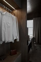 In each of the suites, a wall separates the bedroom from the closet area.