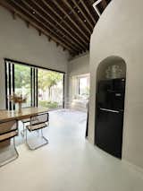 The massive glass doors in the living area slide open and connect the interior to the backyard.