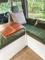 The couple  chose rich fabrics that add texture and interest in the living area.  Photo 7 of 20 in An Australian Couple Turn a Bus Into a Traveling Tiny Home and Physical Therapy Practice