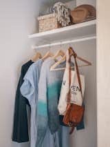 A walk-in closet is situated between the living area and the bathroom.