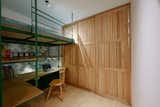 3T2 House by Khuôn Studio bedrooms with sliding wood partition