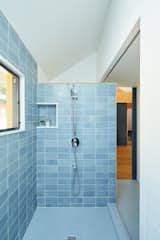 Bath Room, Cement Tile Floor, Ceramic Tile Wall, Corner Shower, and Open Shower "The bathroom has a spa-like feel and it seemed natural to choose light blue tiles,  Edwin Fang’s Saves from A Color-Blocked ADU in Los Angeles Takes a Cue From Talking Heads