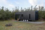 Project 01, a 262-square-foot micro cabin imagined by Canada-based Instead is clad with black-stained pine that helps it to meld with the natural landscape.