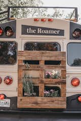 A hanging garden made from a shipping pallet attaches to the rear exterior of the bus, allowing Brackney to grow his own herbs and flowers.