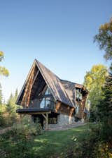 Larger windows fill the home with daylight and forest views.