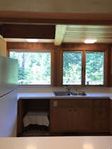 Before: Kitchen of Minne Stuga by Taiga Design + Build