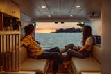 Ethan and Katelynn love to sit in the dinette area, with the rear doors of the van open, and watch the sunset over the ocean together.