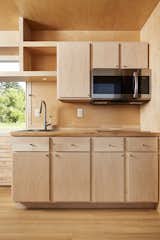 The all-electric tiny homes feature shelves and cabinets for storage.