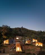 In the evening, the cabins glow like lanterns that sit on top of stacked stone walls. "We didn't buy a single stone,