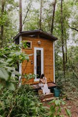 Wrapped in wood, the tiny homes are surrounded by lush foliage that lends privacy and respite.