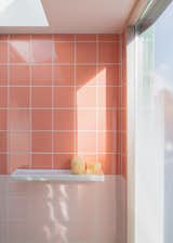 The pink tile in the kids’ bathroom was inspired by a David Hockney painting.